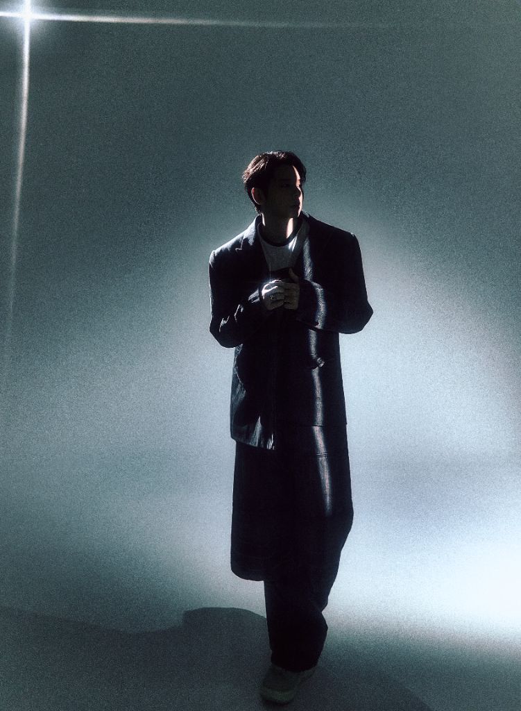 Raiden in long coat under spotlight